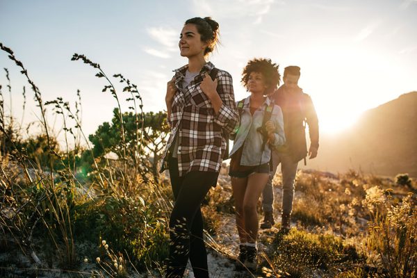 Friends hiking in a line
