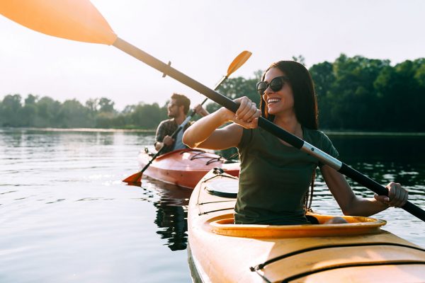 Couple kayaking on still waters